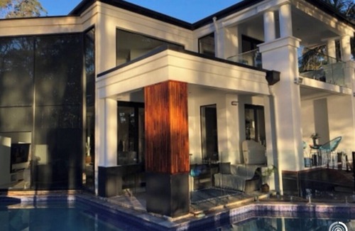 Kings Point House | Lake house with pool and theatre room