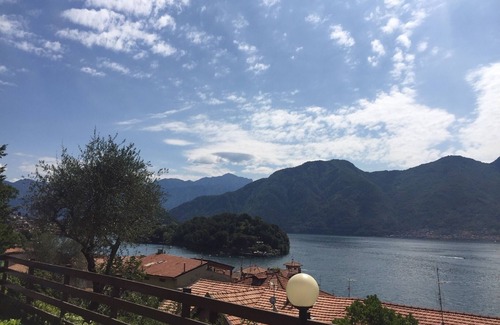 Sala Comacina Apartment | Lake View. Beautiful three-room apartment with garden and pool. Lake Como.