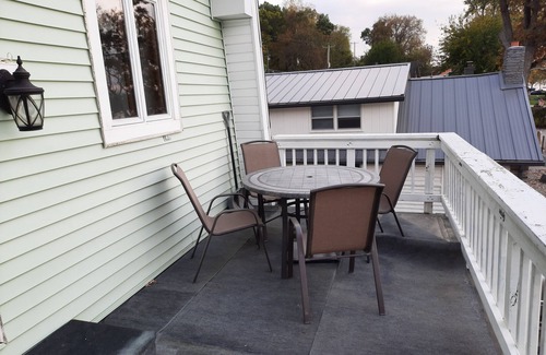 Sand Creek House | Lakeside Beach Getaway with A Gorgeous Kitchen & Dining Room with Room for 10.