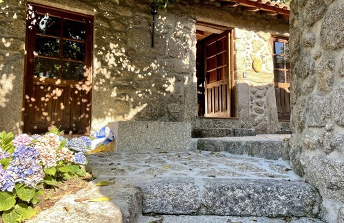 Terras de Bouro Cottage | Lakeside cottage with fireplace, views and terraced gardens