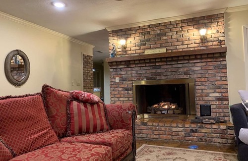 Hattiesburg House | Lakeside pavilion on private lake with a boathouse, outdoor fireplace, kayaks.