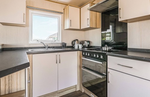 Cardigan House | Large 12ft-wide caravan with one double with en suite W.