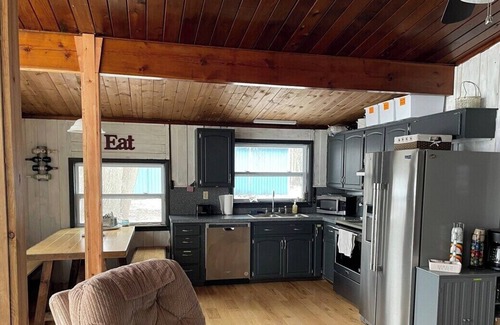 Elk Rapids Cottage | Latitude Adjustment: Lakefront with Beach & Kayaks