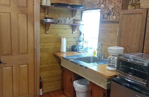 Athens Cabin | Laurentius' Cabin on a Koi Pond