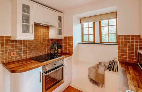 Llanddeusant Cottage | Llynon Lodge - a cosy fire that sleeps 4 guests in 2 bedrooms