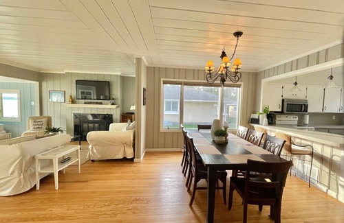 Traverse City House | Located directly on East Grand Traverse Bay with sandy beach