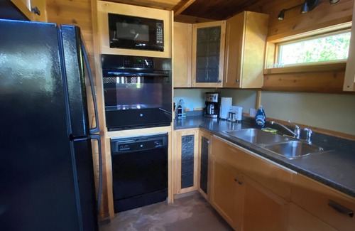 Revelstoke Cabin | Lodge with Direct ATV Trail Access, Hot Tub and ShopnIt’s the Perfect Home Base!