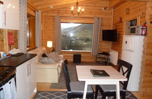 Spittal of Glenshee Cabin | Log Cabin with Hot Tub & Sauna for 2/3 | In the Cairngorm National Park | Great Views