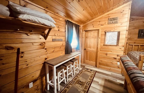 Thompsonville Cabin | Log Cabin with Hot Tub 2 Miles from Crystal Mountain!