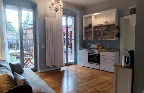 Rheinsberg Condo | LoggiaHaus am Schloss, Pelle vacation apartment on the ground floor with terrace and courtyard garden