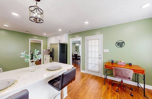 Cameron House | Lovely home with screened-in patio, fireplace, pool, playground, & gym access