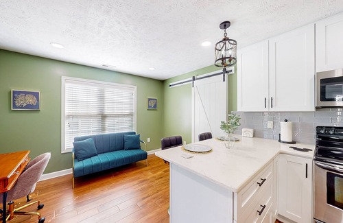 Cameron House | Lovely home with screened-in patio, fireplace, pool, playground, & gym access