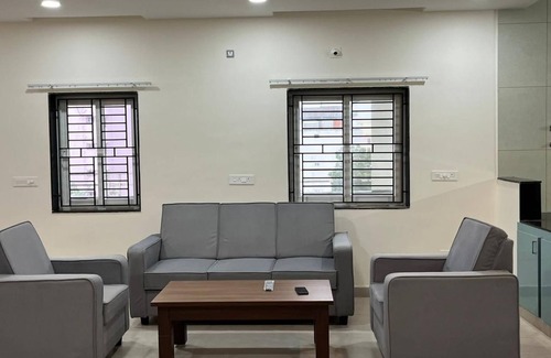 Tirupati Apartment | Luxe 2 BHK Flat with a vast living room, wifi and Air conditioning in Tirupati.