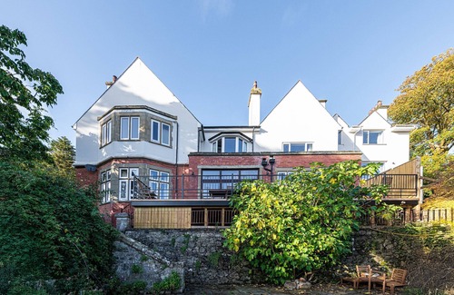 Menai Bridge House | Luxurious Arts and Crafts Home set in 5 Acres of Garden & Woodland onto Straits