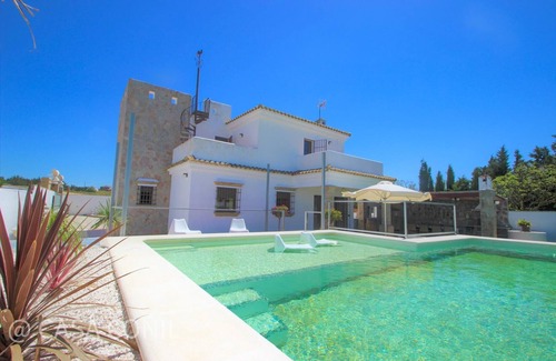 Conil de la Frontera House | luxurious villa in quiet surrounding for 6 guests with large pool and precious terraces and nice bbq-area and seaview in the distance