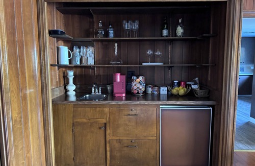 East Pasadena House | Luxurious large master bedroom with separate refrigerator coffee maker bathtub