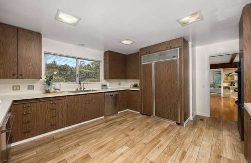 East Pasadena House | Luxurious large master bedroom with separate refrigerator coffee maker bathtub