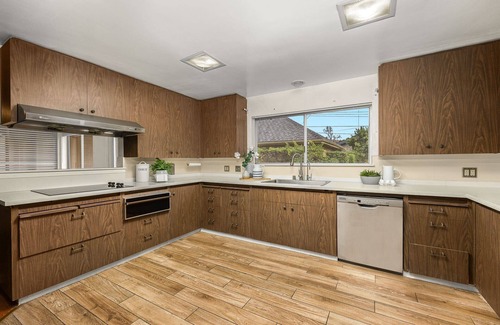 East Pasadena House | Luxurious large master bedroom with separate refrigerator coffee maker bathtub