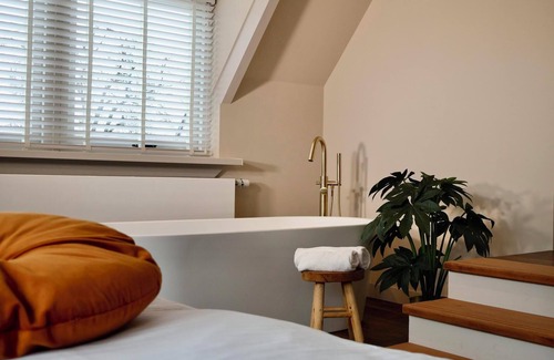 Appeltern Hotel | Luxurious suite with river meadow views, modern amenities, and an elegant, relaxing atmosphere.