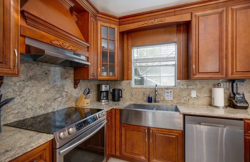 Dunedin House | Luxury 5 Bedroom Dunedin home ~ TWO full kitchens, heated pool, hot tub!