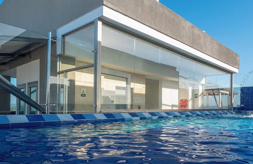 Urbanizacion Eliana Condo | Luxury Airport Penthouse - 3 BD 2 BA Suite + Rooftop Pool