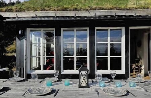 Ringsaker Cabin | Luxury cabin Sjusjøen with hot tub, ski in/out, fireplace & WiFi