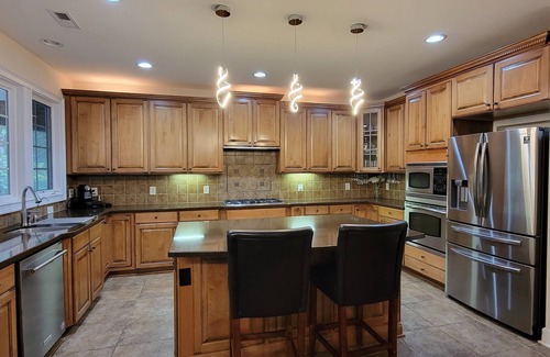 Cary House | Luxury Cary Retreat with Koi Pond & Prime Location