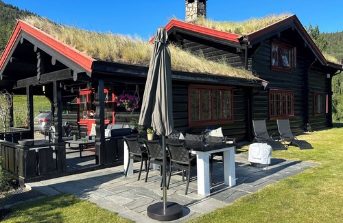 Dølemo House | Luxury hillside family home with panoramic views, sauna & hot tub