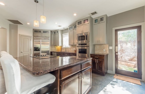 Paleface Park House | Luxury Lake Travis Waterfront River Retreat: Heated pool, yard, pool table