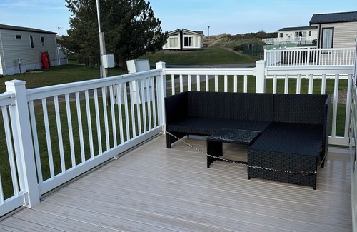 Lossiemouth House | Metres from the beach. Cosy, family friendly mobile home with decking.