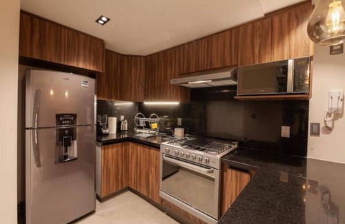 Colonia Cuauhtemoc Apartment | Mid-Century's Morning Embrace: Revel in 'Nowness' Amidst Roma's Radiance.n