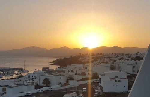 Puerto del Carmen Apartment | Modern apartment ,stunning sea and mountain views in the old town. WiFi and pool