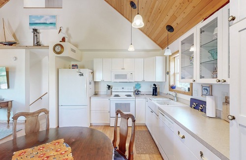 Avon House | Modern Avon retreat with beach access, community pool, and stunning water views