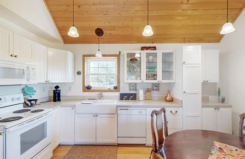 Avon House | Modern Avon retreat with beach access, community pool, and stunning water views
