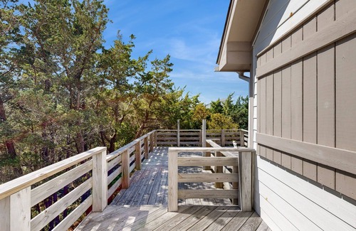 Avon House | Modern Avon retreat with beach access, community pool, and stunning water views