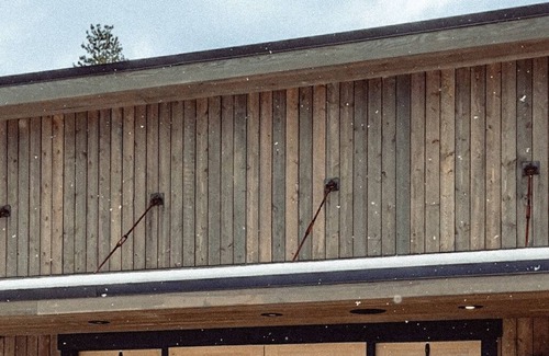 Clancy Cabin | Modern cabin on 10 creek front acres with large gas fire pit.