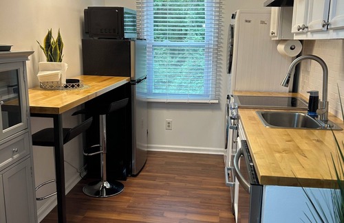 Fayetteville Apartment | Modern, fully equipped studio with separate sleeping area in Fayetteville.