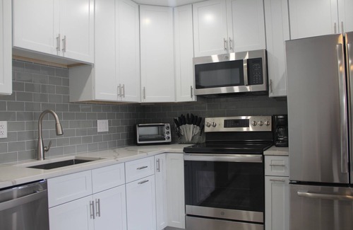 Village Green House | Modern Getaway within walking distance to the harbor!
