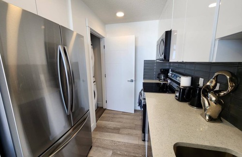 Southeast Calgary Condo | Modern Ground-Level Condo, Private Entrance, Walk to Shops, YMCA, Sleeps 4