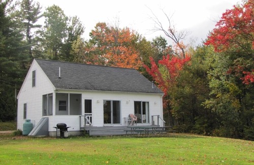 Meredith House | Modern lakefront home on Lake Waukewan with spectacular fall folliage views!