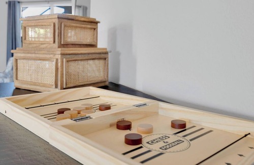 Palm Harbor House | Modern Poolside Getaway w Games, Fire pit & Family Fun