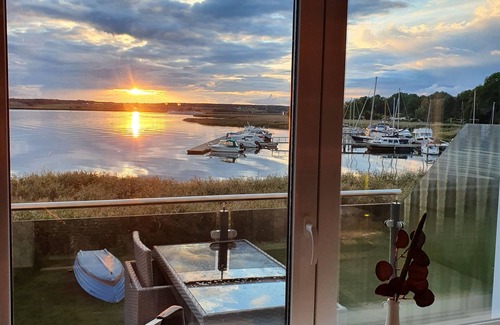 Ziemitz Condo | Modern vacation apartment with balcony directly on the Peene