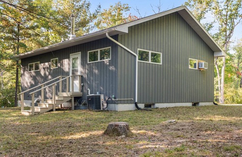 Big Rapids House | Nestled in the woods, this private detached Guest House is a perfect getaway!