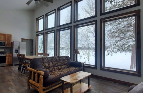 Phillips Cabin | New cabin with lake-facing windows on 400-acre Long Lake of the Phillips Chain.