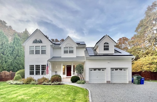 Westhampton House | NEW DECK! Private 1 Acre Family Friendly Home - Heated Pool, Home Office & Gym