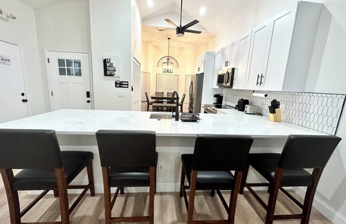 Buena Ventura Lakes House | New Modern Oasis with private heated pool near MCO Airport, Disney, and Parks!