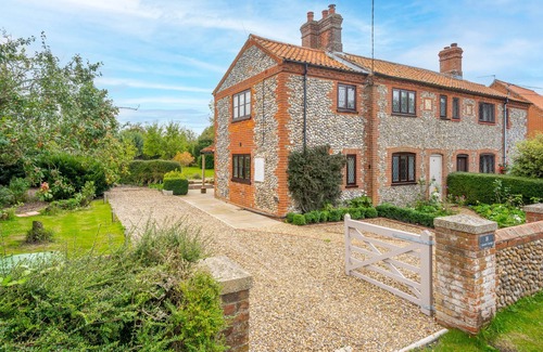 Sharrington Cottage | Newly renovated Brick & Flint cottage with stylish interiors, wood burning stove, beautiful garden,