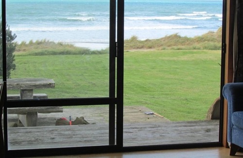Mataikona House | Ocean-front beach house with warm outside shower.