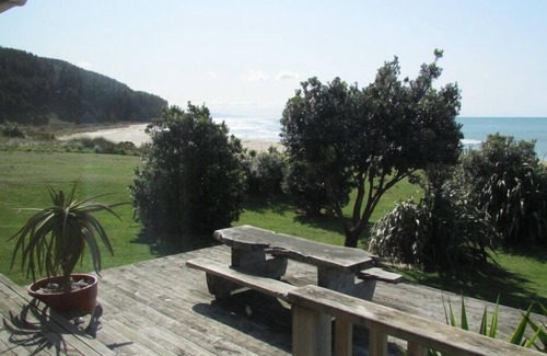 Mataikona House | Ocean-front beach house with warm outside shower.
