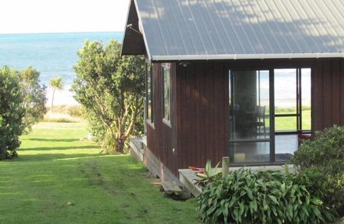 Mataikona House | Ocean-front beach house with warm outside shower.